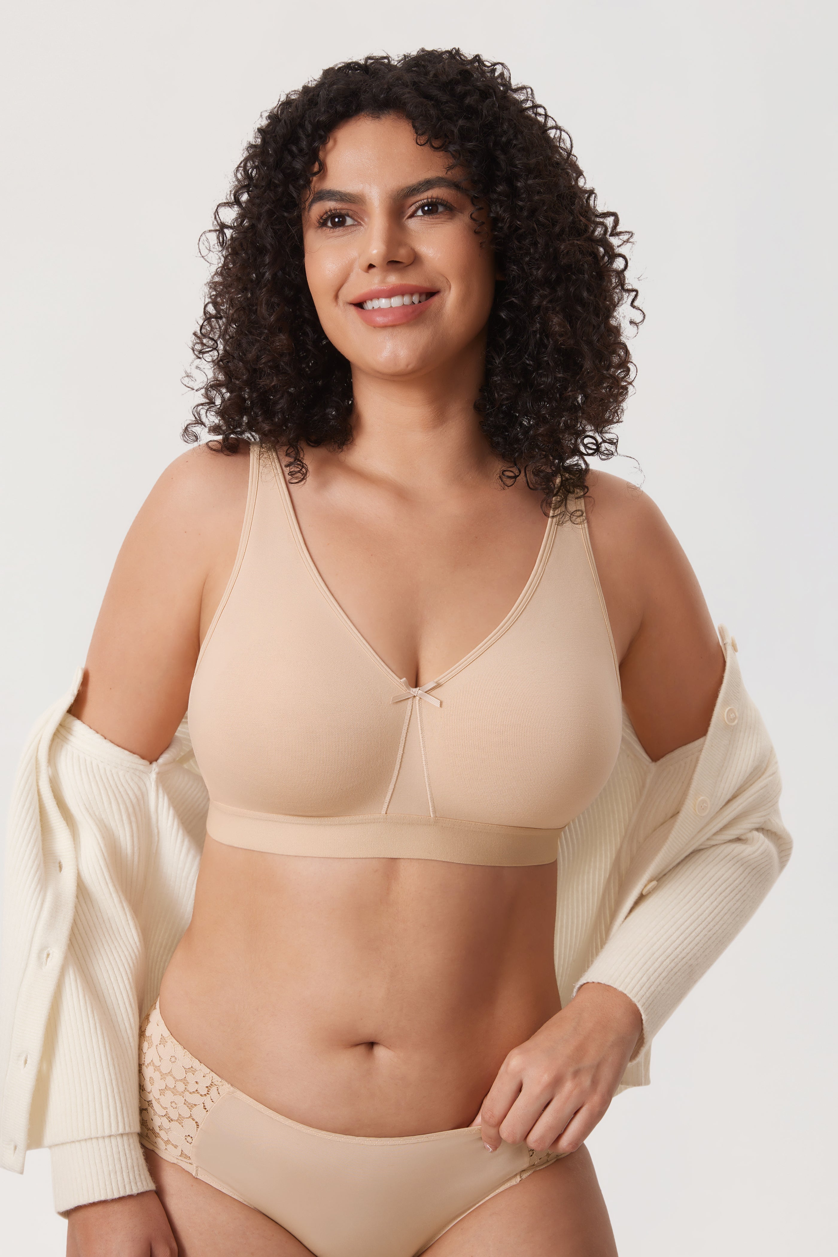 Side angle of cream wireless full cup minimiser bra showing wide underband support - MissFine