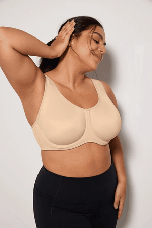 Side angle of full coverage underwire sports bra highlighting molded cup shape and support band - MissFine