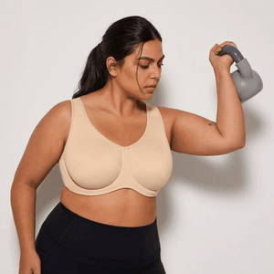 Front view of nude plus size sports bra showing smooth seamless cups and full coverage neckline - MissFine