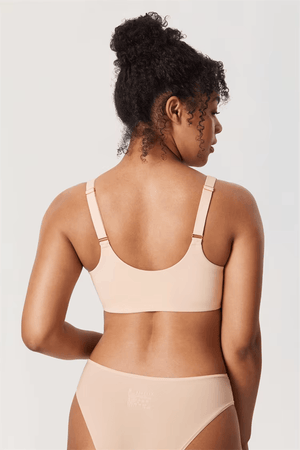 Back view of nude T-shirt bra with smooth band and adjustable shoulder straps on model - MissFine