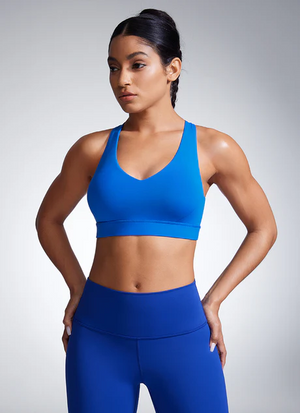 Side angle of seamless padded sports bra highlighting molded cup shape and supportive elastic underband - MissFine