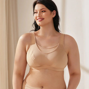 Front view of nude plus size sports bra with molded full-coverage cups and mesh neckline - MissFine