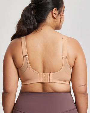 Back view of nude wire-free sports bra with wide band and hook-and-eye closure for full coverage - MissFine