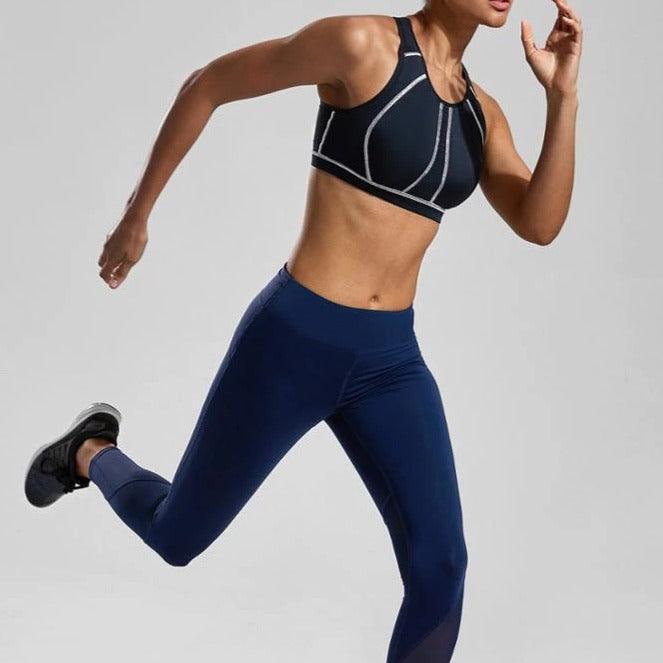 Close-up of seamless molded cup and moisture-wicking fabric on black sports bra - MissFine