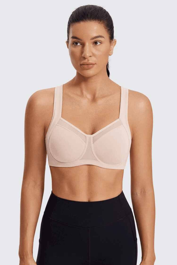 Side angle of nude full coverage sports bra showing smooth molded cups and extended band - MissFine