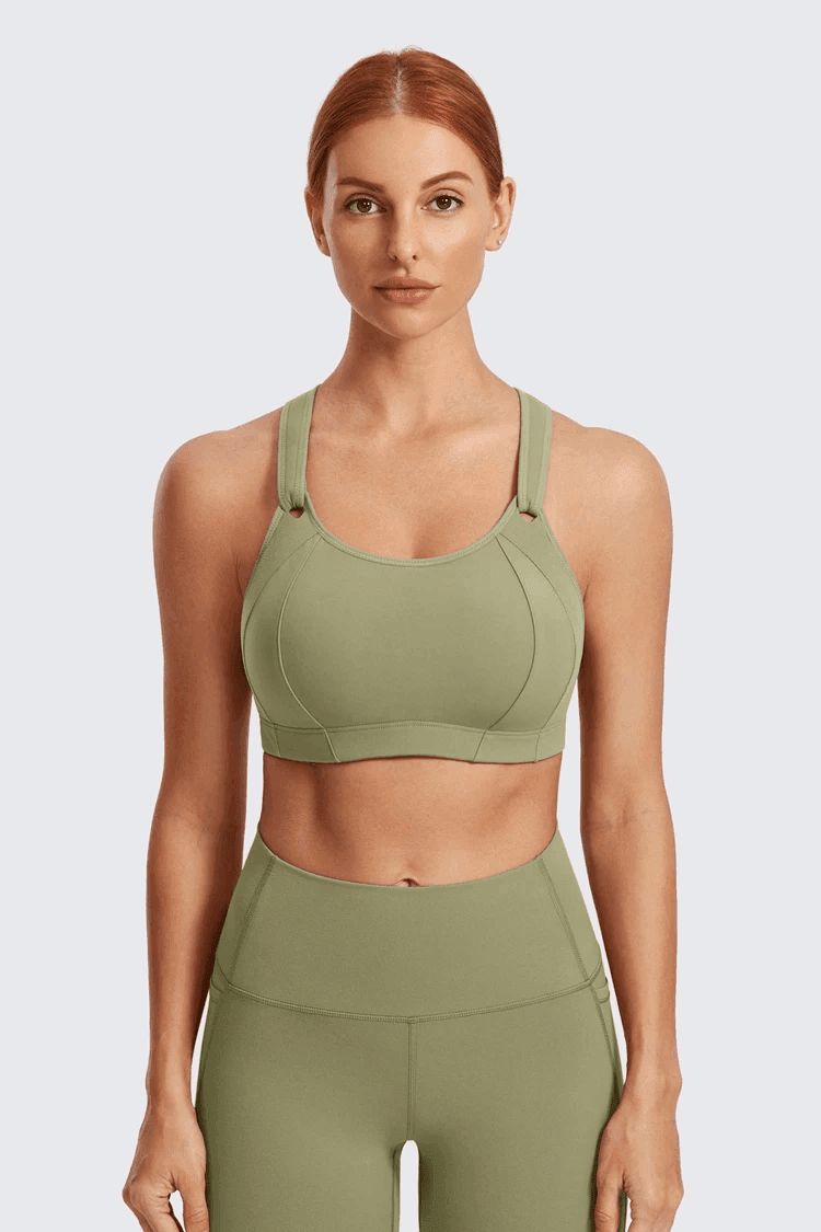 Close-up of orthopaedic molded padded cup and wide elastic underband on sage green plus size sports bra - MissFine