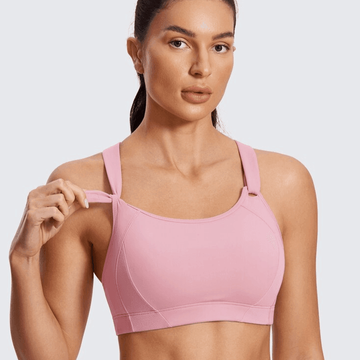 Side angle of pink wireless sports bra showing wide underband and molded padding - MissFine
