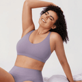 Front view of lavender seamless bra with molded cups and wide underband on model - MissFine