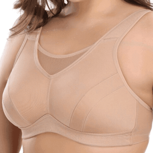 Side angle of nude seamless sports bra showing smooth molded cup shape and support - MissFine
