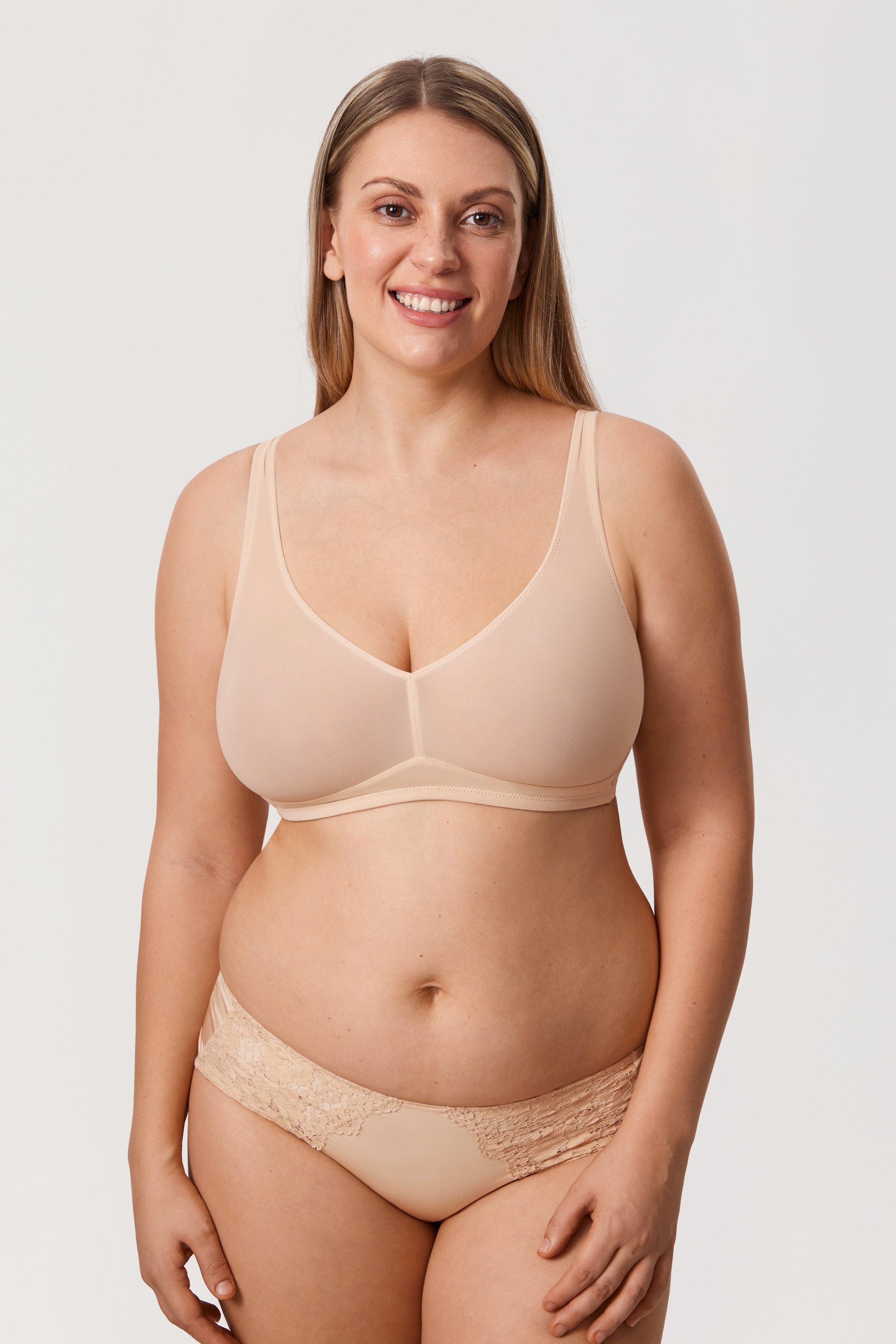 Close-up of molded seamless cup and wide strap detail on nude minimiser bra - MissFine
