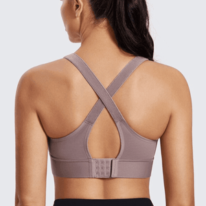 Close-up of front zipper and molded cups on plus size padded sports bra in black - MissFine