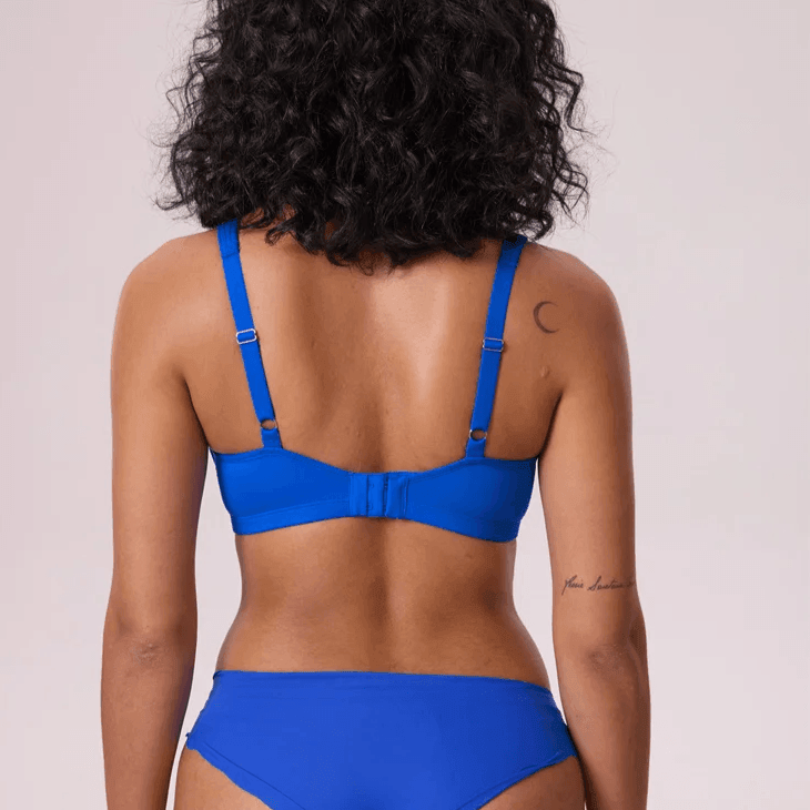 Back view of blue bra showing wide reinforced band, adjustable straps and hook-and-eye back closure - MissFine
