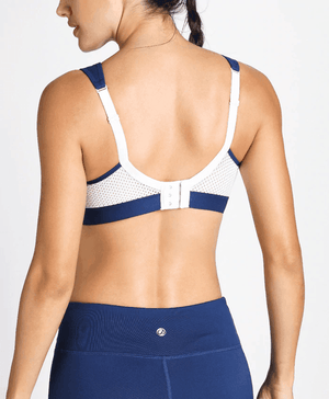 Front view of white sports bra with navy trim, molded cups and wide straps for extra coverage - MissFine