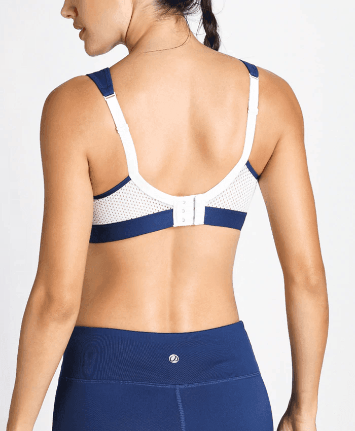 Front view of white sports bra with navy trim, molded cups and wide straps for extra coverage - MissFine
