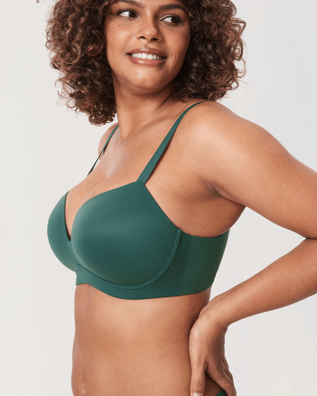 Close-up of molded cup detail on non wired padded plunge bra in deep teal green - MissFine