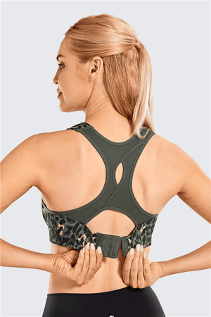 Close-up of sweat-wicking textured fabric and molded cup contour on black sports bra - MissFine