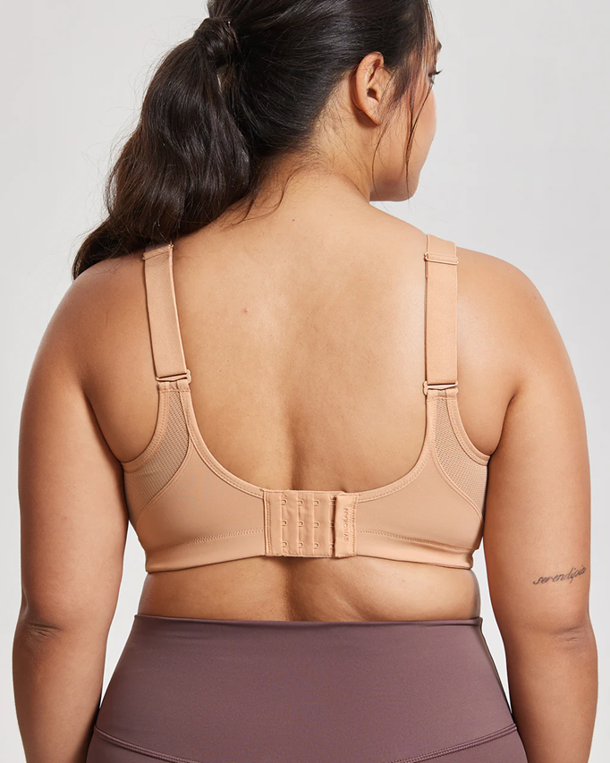 Back view of nude wire-free sports bra with wide band and hook-and-eye closure for full coverage - MissFine