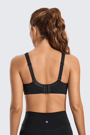 Close-up of breathable mesh panel between molded cups on nude sports bra front - MissFine
