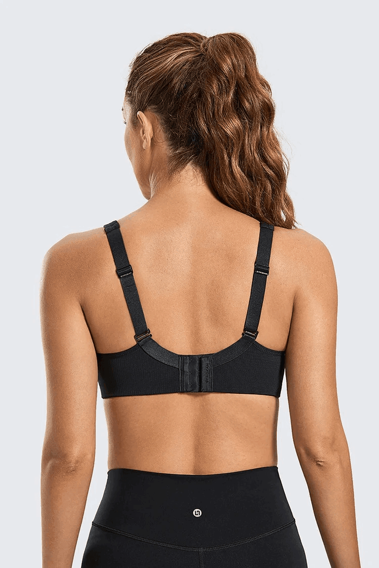 Close-up of breathable mesh panel between molded cups on nude sports bra front - MissFine