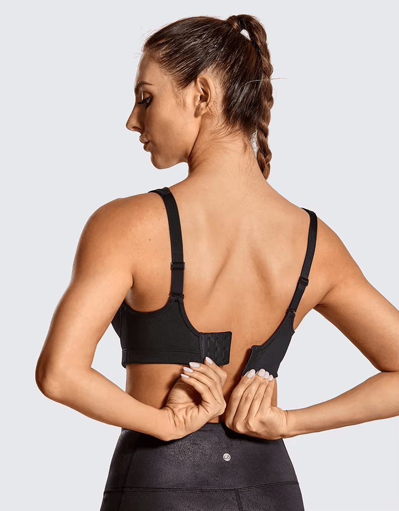 Close-up of molded padded cups and smooth athletic fabric on plus size sports bra - MissFine