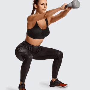 Side angle showing wide adjustable straps and padded underwire support on black sports bra - MissFine