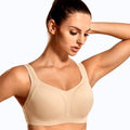 Front view of nude full cup padded sports bra with underwire and wide straps on model - MissFine