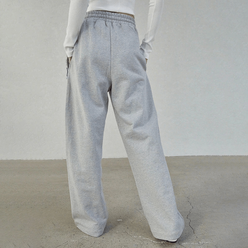 Fashionable trousers combined with jeans for a cool feminine look