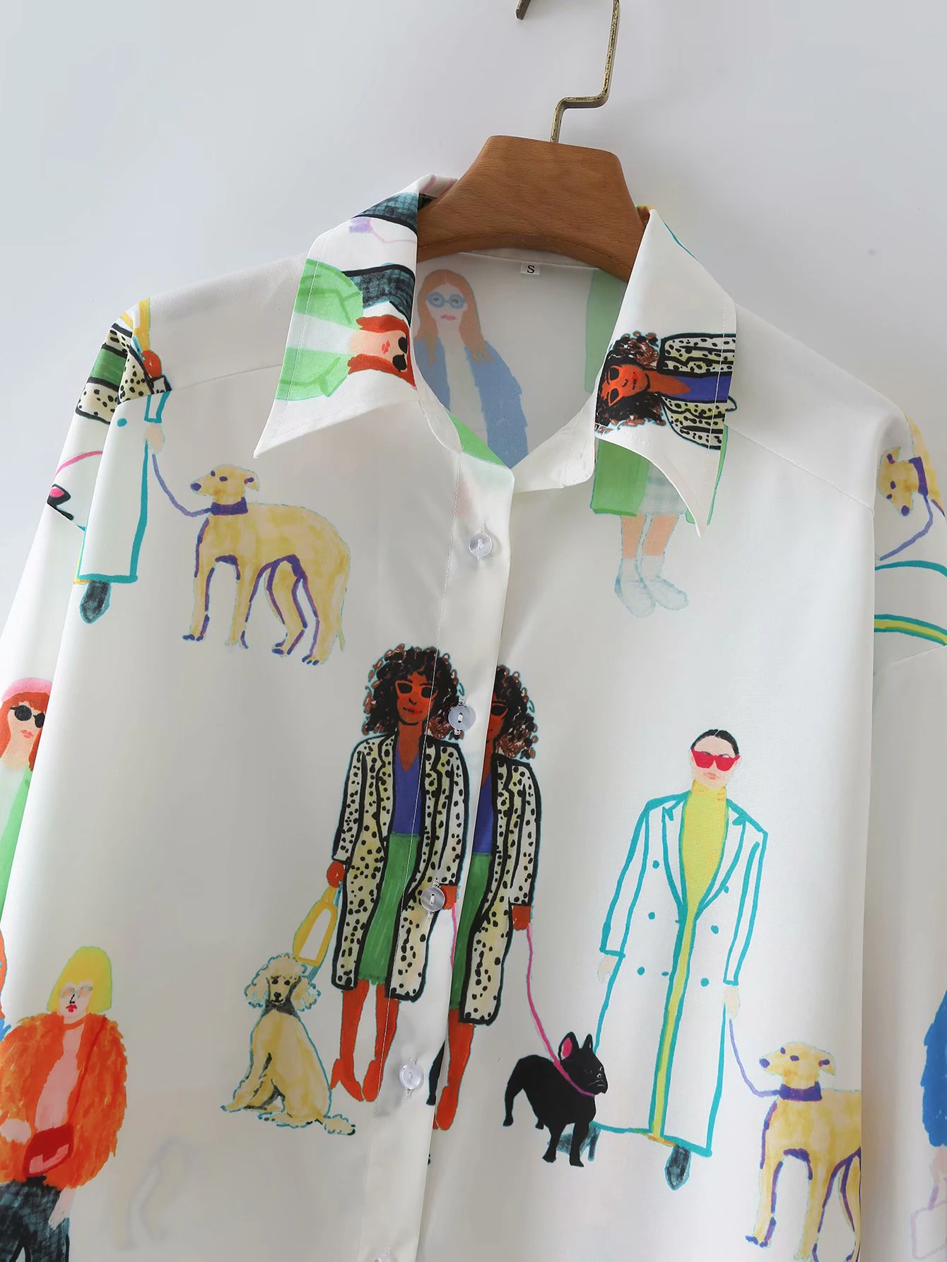 A designer's blouse with lovely illustrations for a trendy feminine look