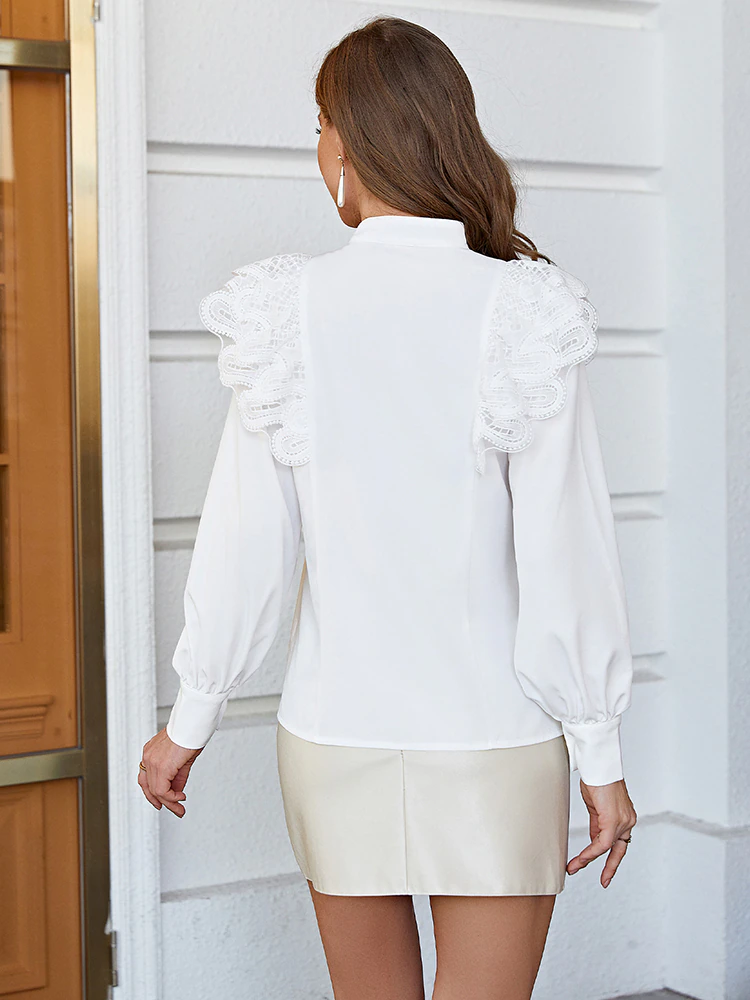 White blouse with lace in a festive feminine cut for a perfect look