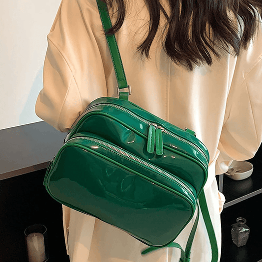 A shiny lacquer style backpack for a sophisticated feminine appearance