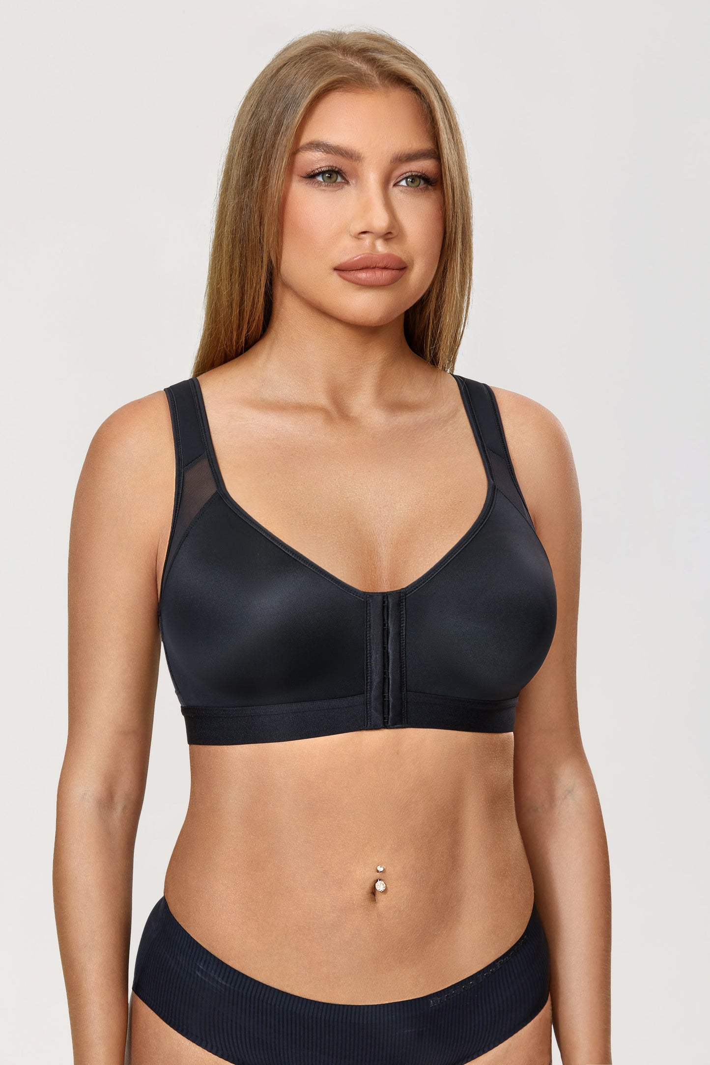 A patented bra that closes in front for an orthopedic grip on the back