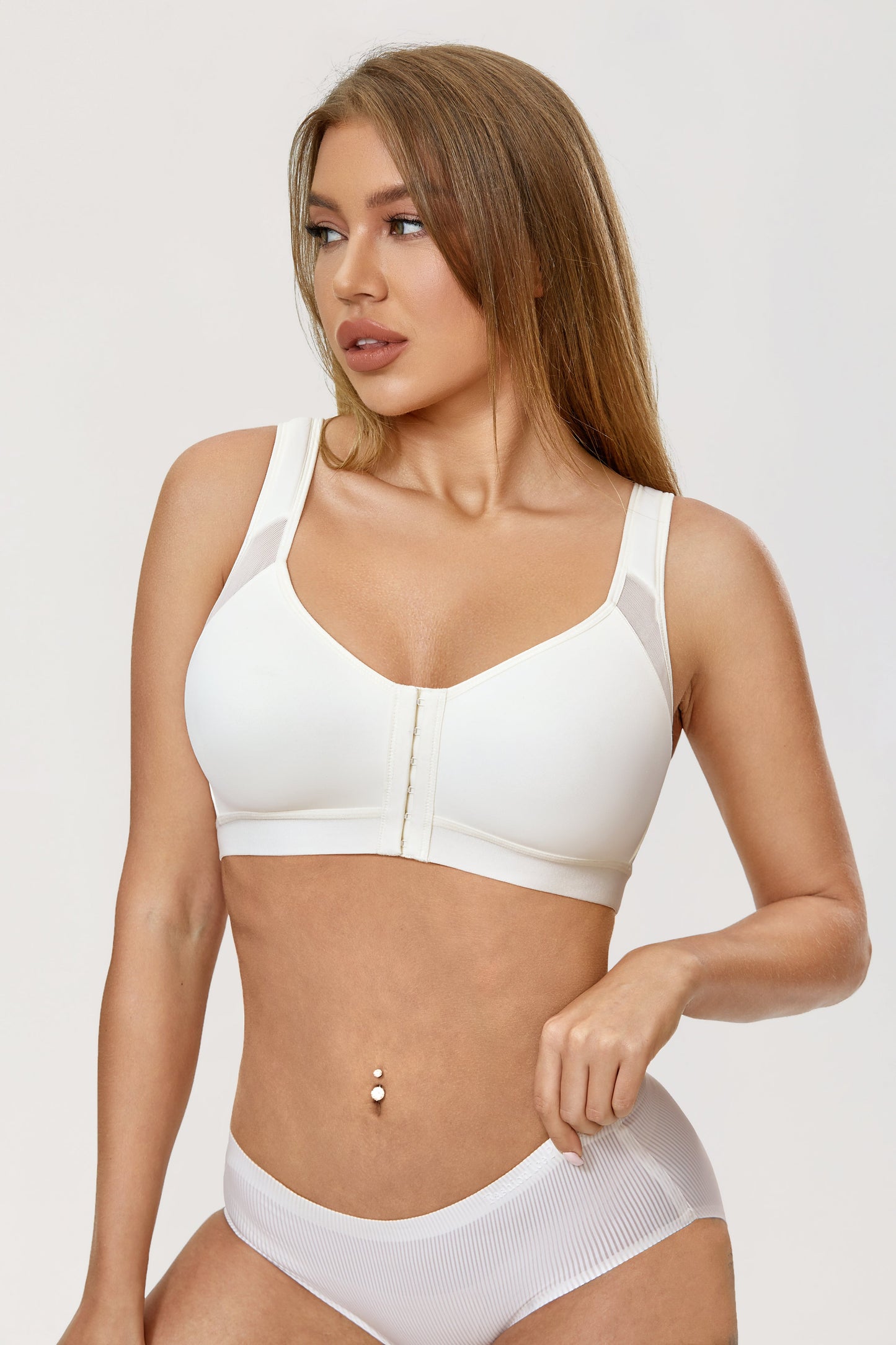 A patented bra that closes in front for an orthopedic grip on the back