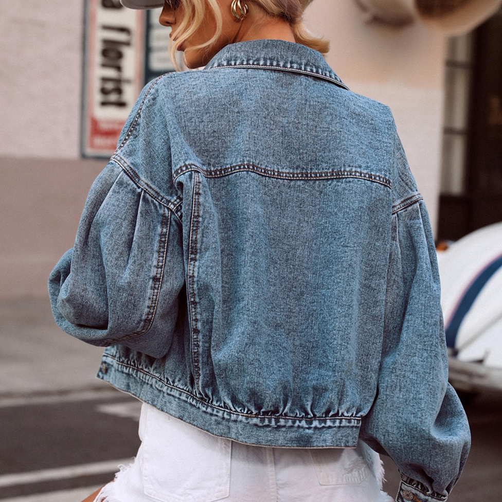 Skinny denim jacket by a designer with puff sleeves for a trendy feminine look