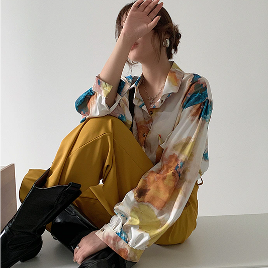 A spectacular tai dai blouse by a French designer for a charming feminine look