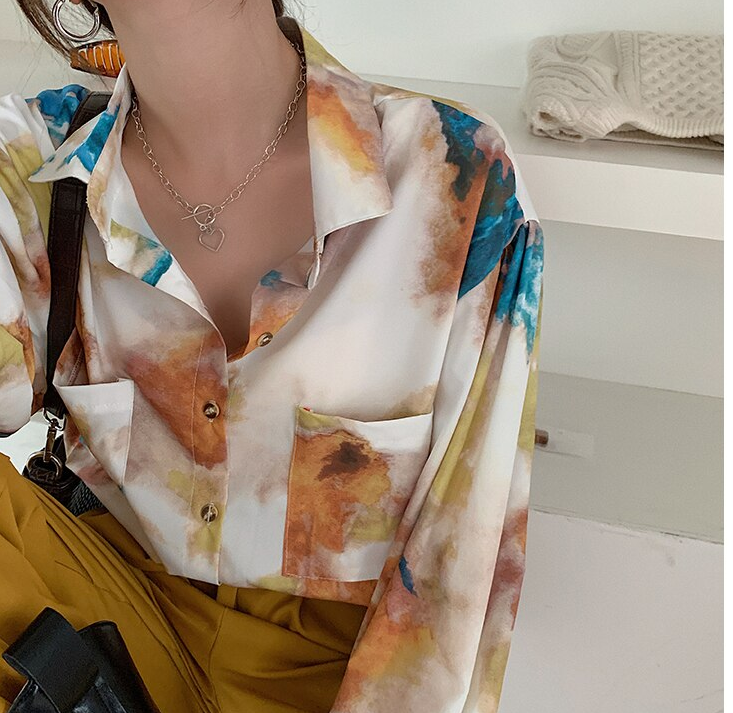 A spectacular tai dai blouse by a French designer for a charming feminine look