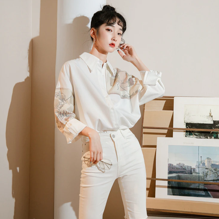 Button-down shirt combined with delicate feminine painting for a mesmerizing look